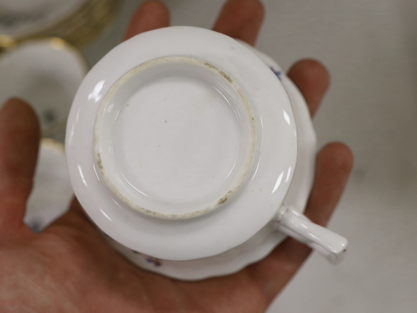 A Victorian bone china part teaset, painted with flowers, the largest 27cm wide